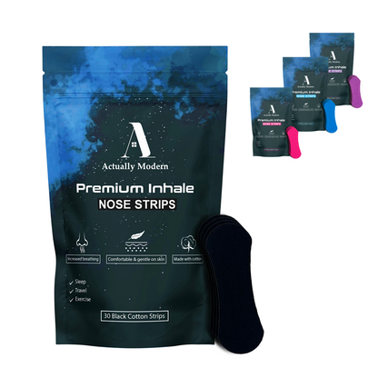 Packaging and strips of hypoallergenic cotton tape by Actually Modern. The packaging is predominantly black with blue text and accents, and displays the product name and key features. This shows all colors of nose tape - black, pink, blue, and purple.